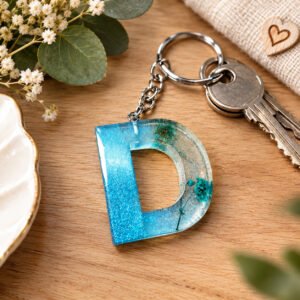 Porte-clés "Lettre D" Bleu ciel,transparent,fleurs turquoises